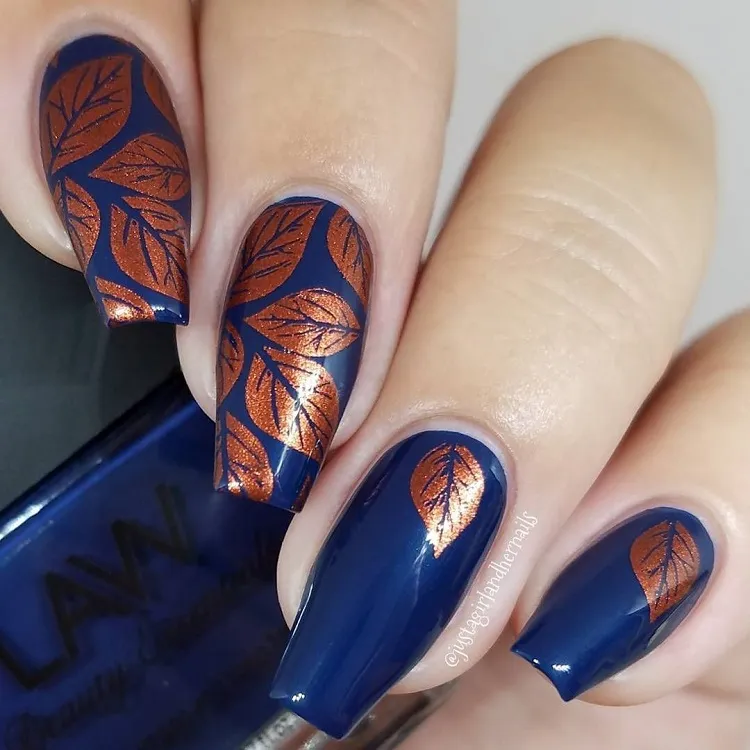 navy blue fall nails design copper glitter autumn leaves decoration 2023
