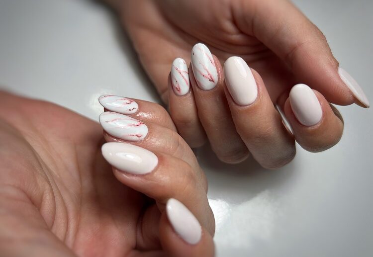 quiet luxury nails 2032 marble manicure with white and pink almond shaped