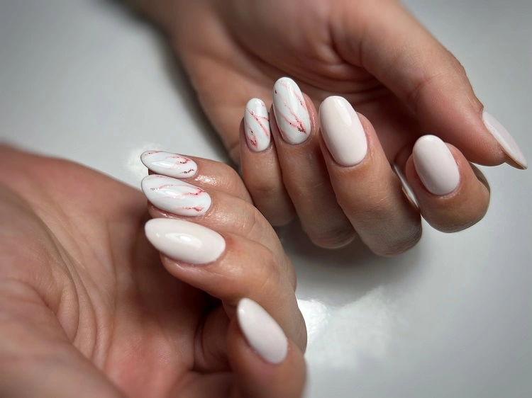 quiet luxury nails 2032 marble manicure with white and pink almond shaped