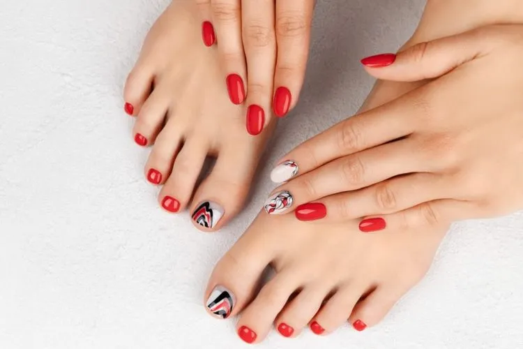 red mani pedi with abstract nail art fall trends