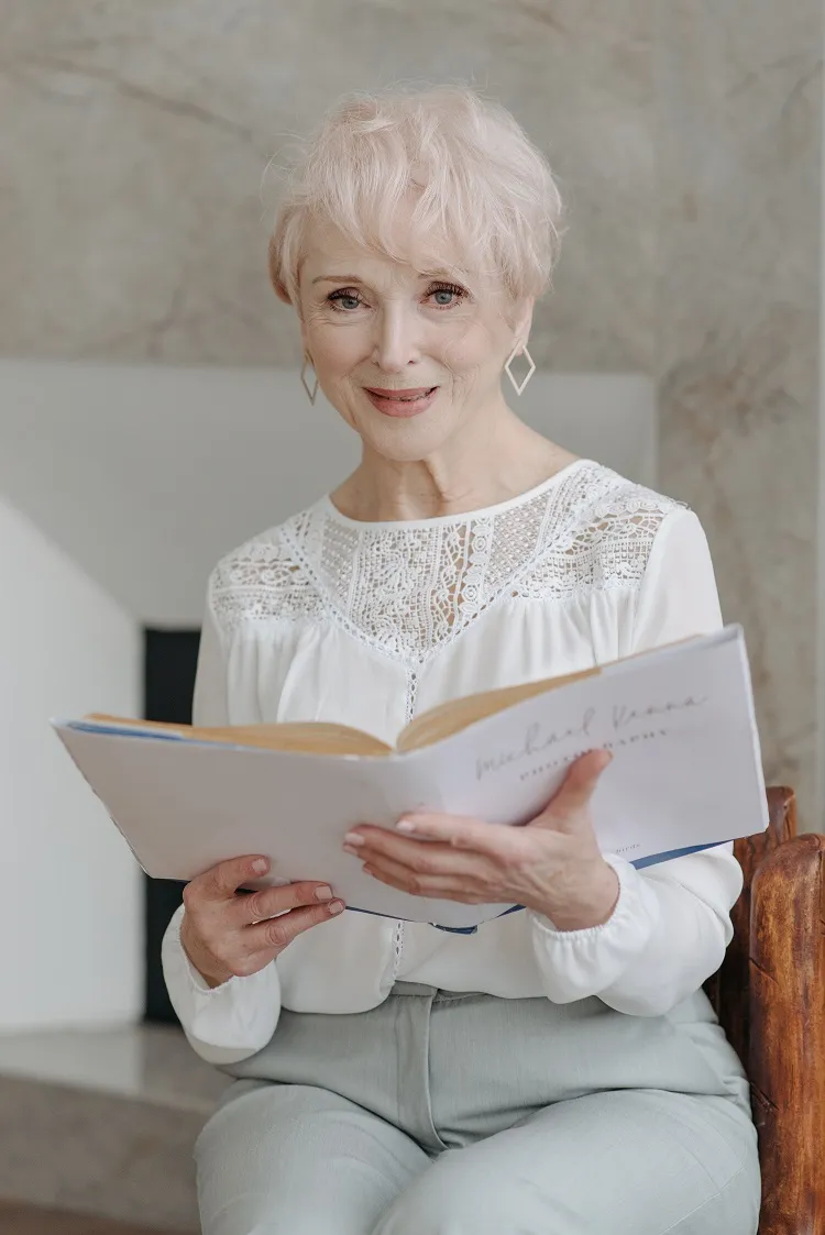 short haircut with side bangs for 60 year old women with white mane