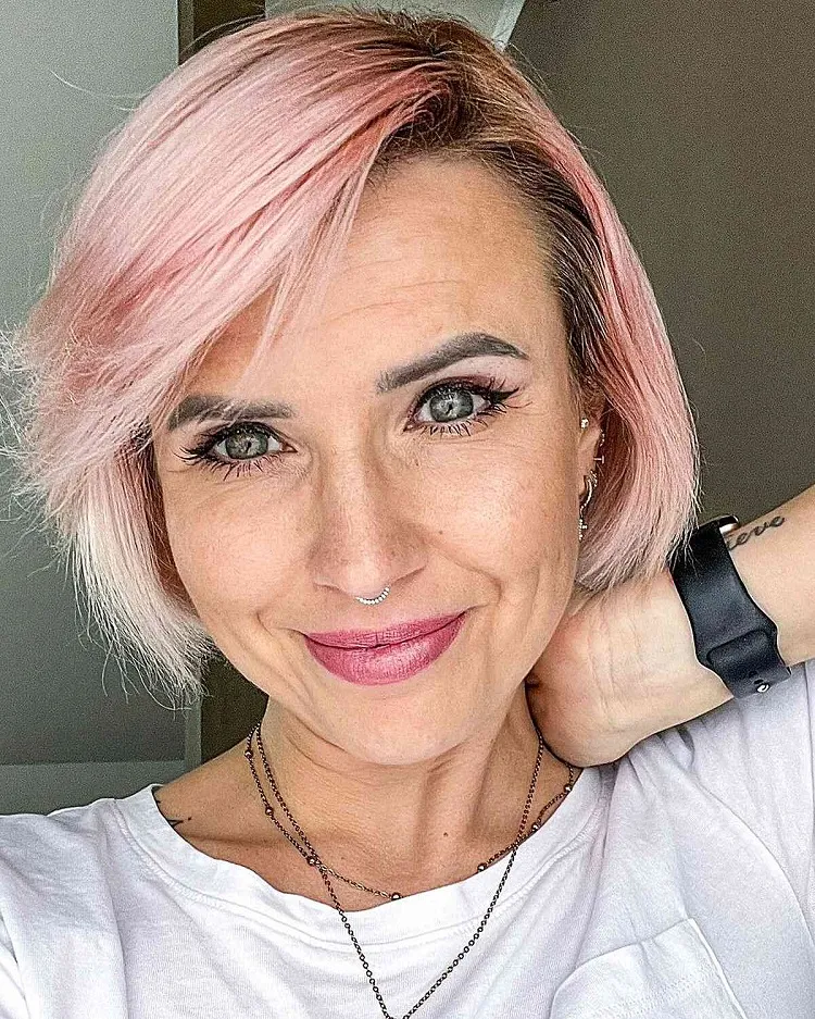 short sweeping bob pastel pink hair women over 50