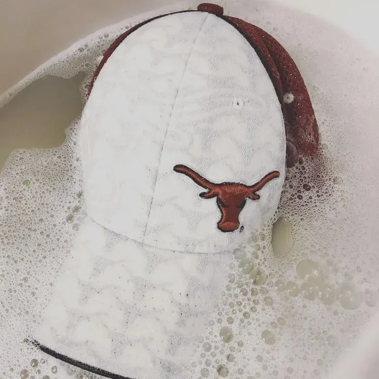 soak and rinse a baseball hat
