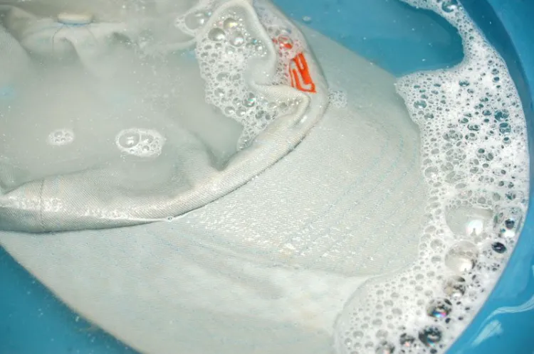 soak baseball cap in sink