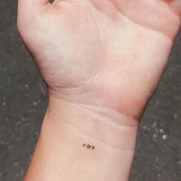 tiny wrist tattoo for women 50 years old