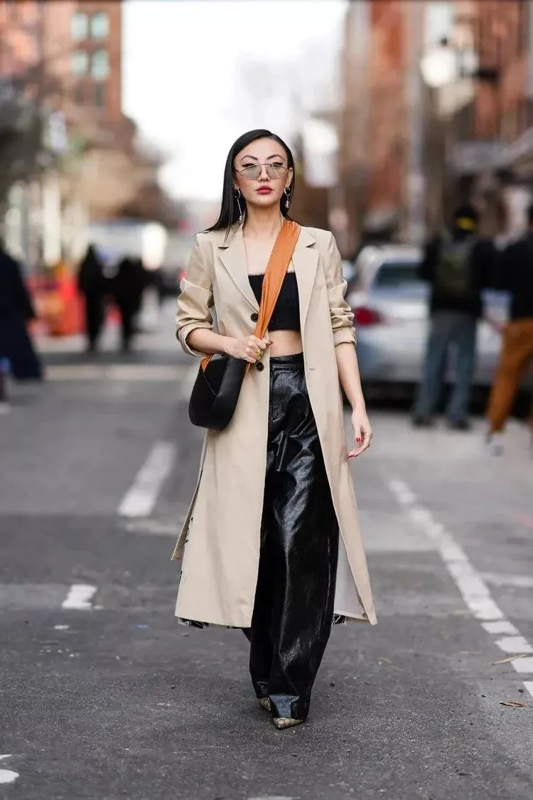 trench coat outfit with crop top and leather pants 2023