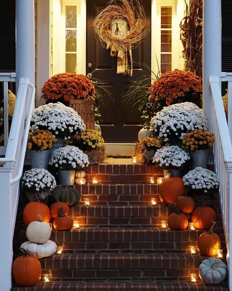 white yellow orange potted mums votive candles artificial pumpkins fall front porch steps decor 2023