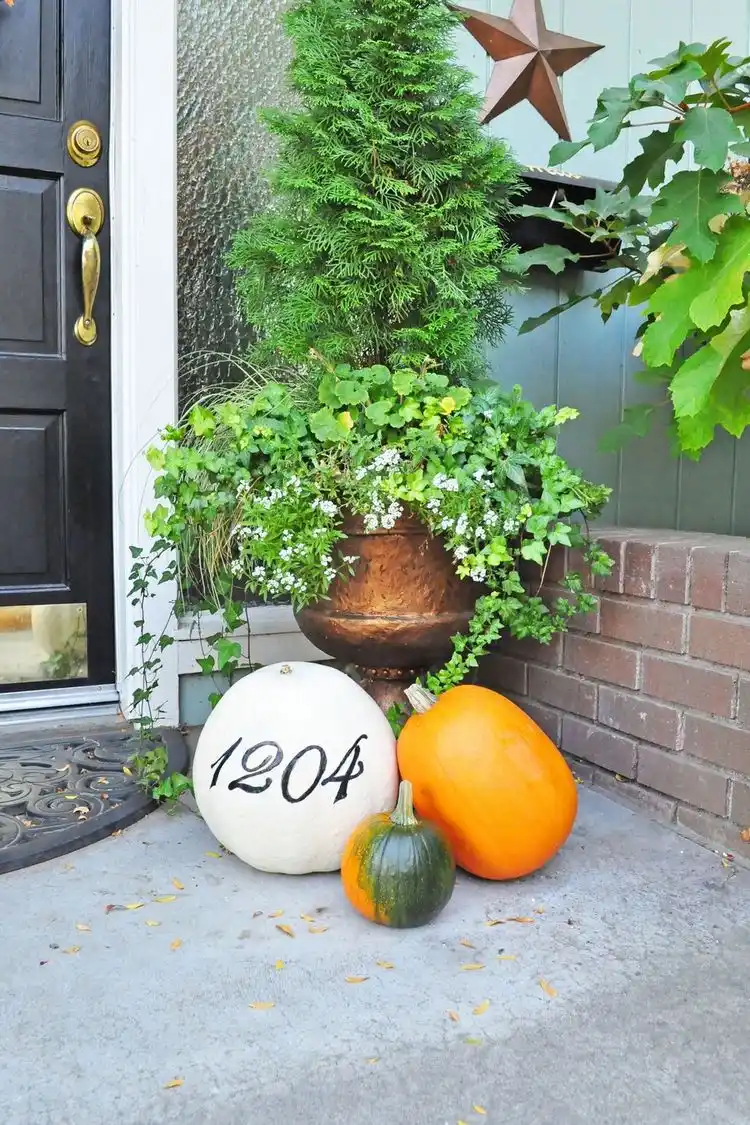 decorate house entrance with pumpkins