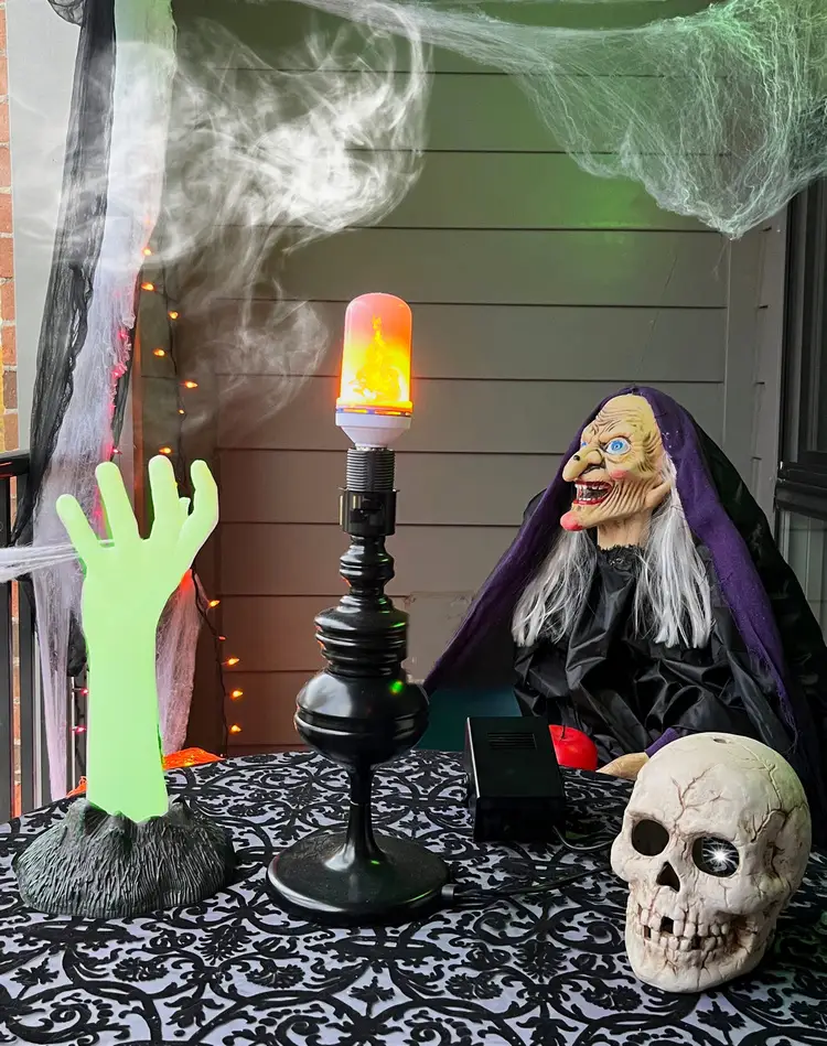 decorate the outdoor sitting area with witch skull and mist