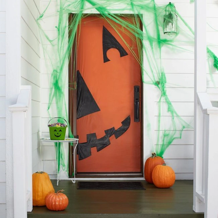 turn your front door into a pumpkin with craft paper