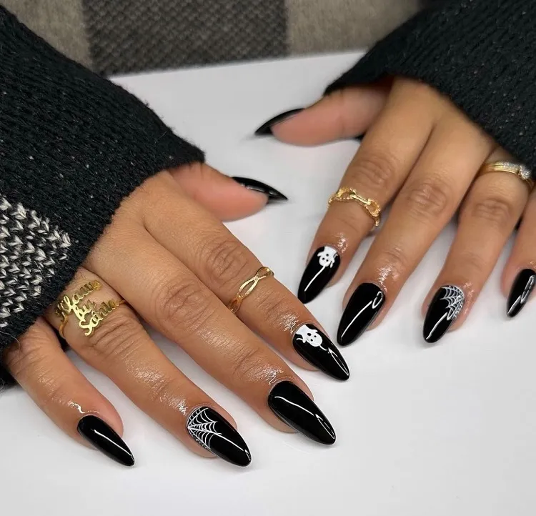 almond shaped black chic halloween nails 2023 for women over 50