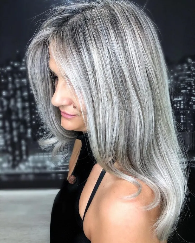 beautiful silver hair with subtle dark pieces for mature women