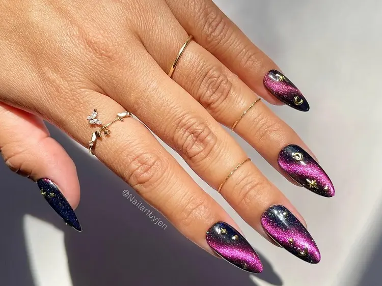 black and pink cat eye nails with golden decorations 2023