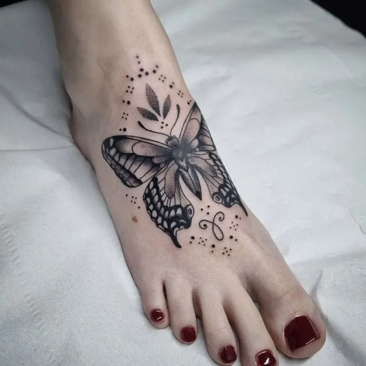 butterfly moth tattoo on leg