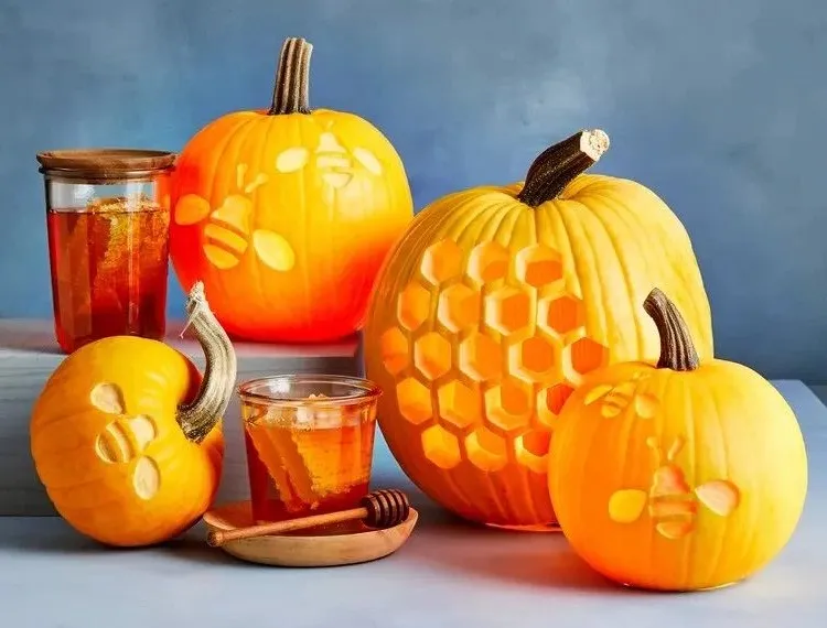 carving pumpkins with bee motifs