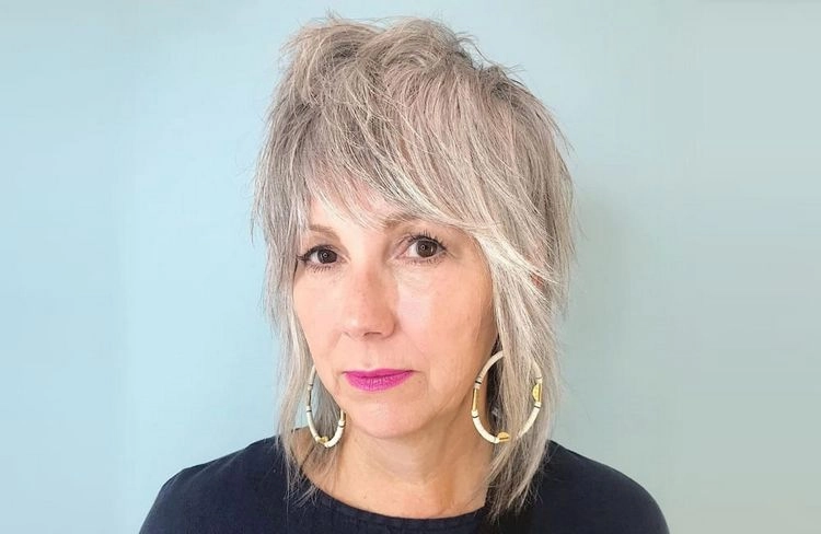 cheeky shaggy shoulder length hair for older women with bangs
