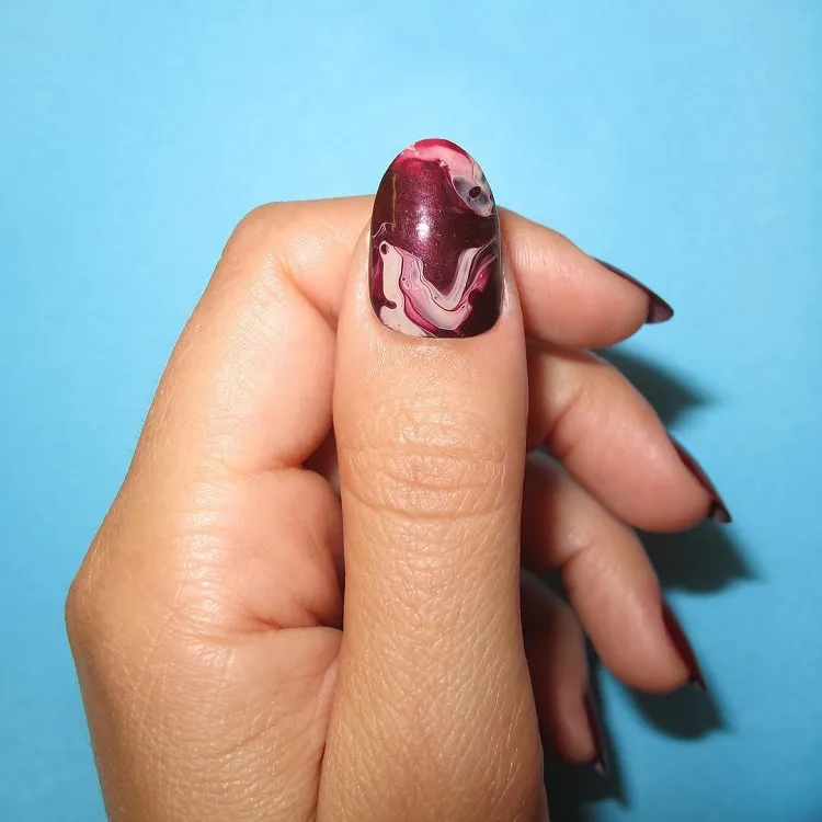 cherry red marble effect fall nails design idea 2023