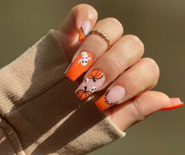 cute halloween orange pumpkin nails with ghosts