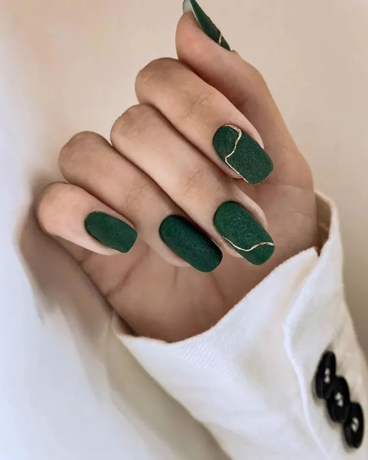 dark green nail art with textured effect