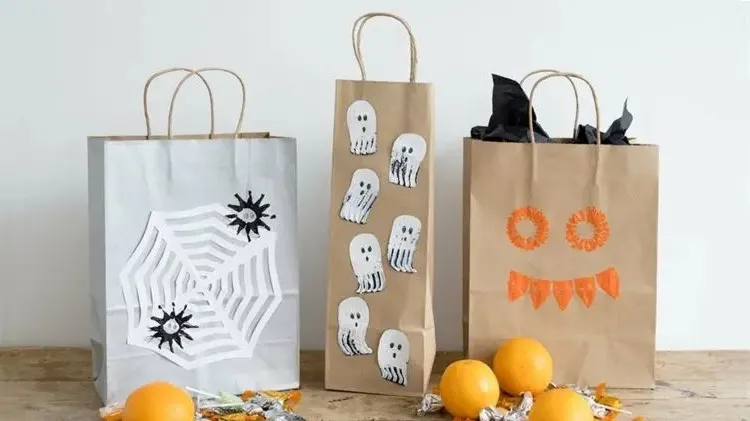 decorative paper bags with spooky designs made from paper and paint