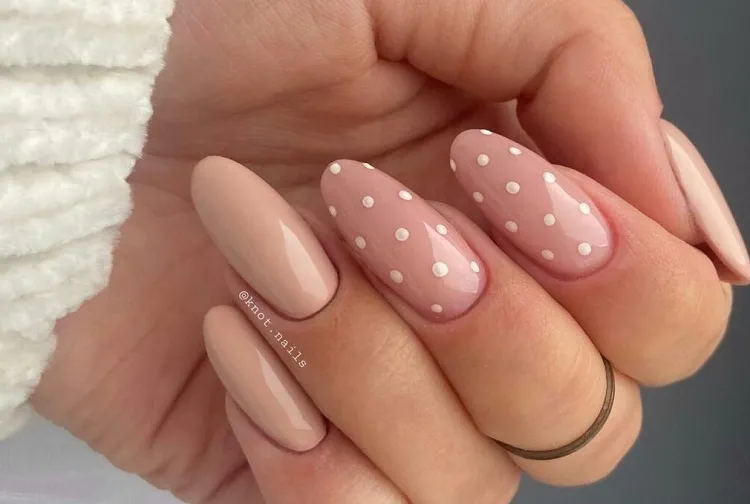 elegant nude nails with dot accents