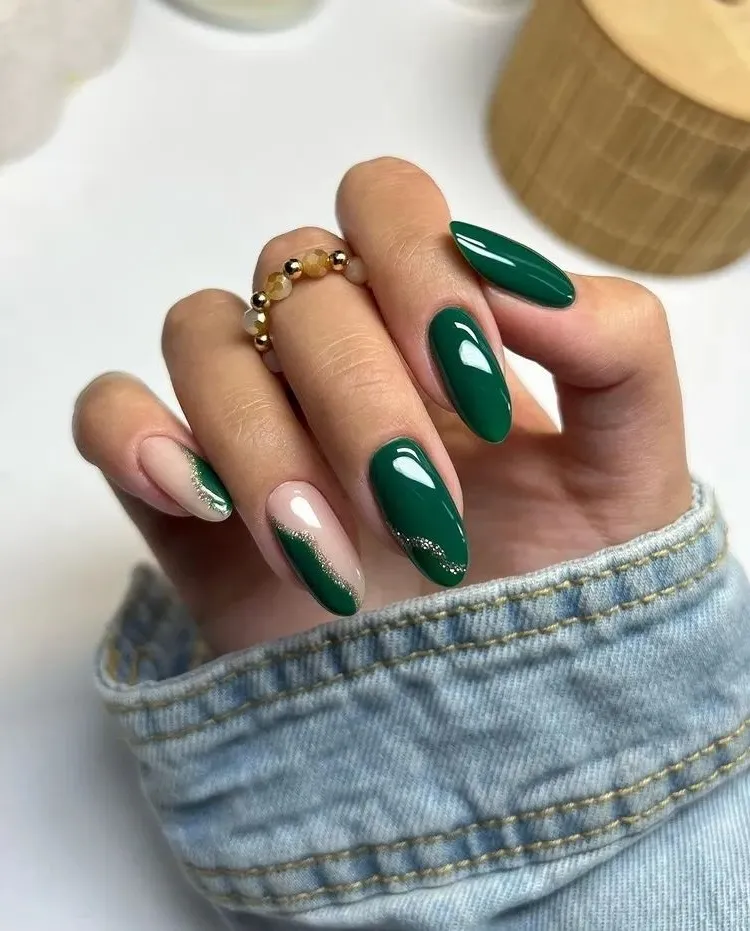 emerald green nail art with silver glitter