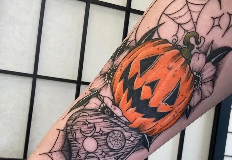 forearm halloween tattoo with a pumpkin 2023