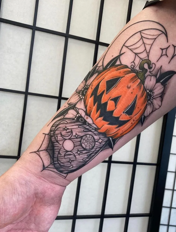 forearm halloween tattoo with a pumpkin