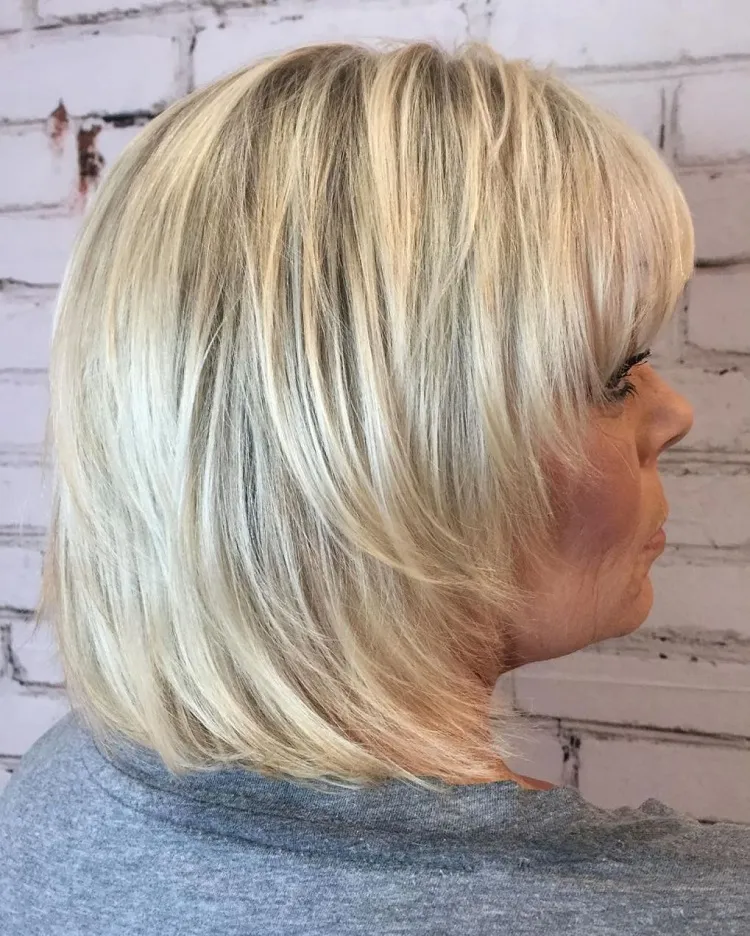 mid length blonde shaggy haircut for 50 year old woman