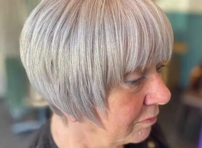 modern short bowl cut for women over 60 wear in fall 2023 hairstyle trends