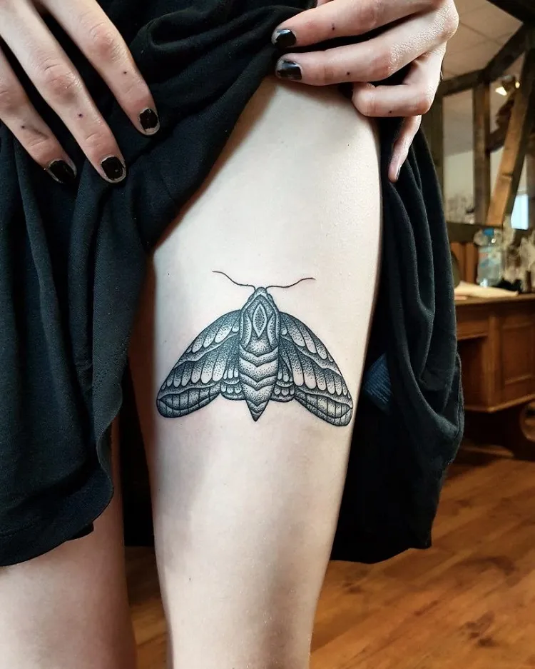 moth on thigh tattoo