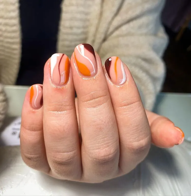 nail art fall 2023 abstract manicure in brown orange and white