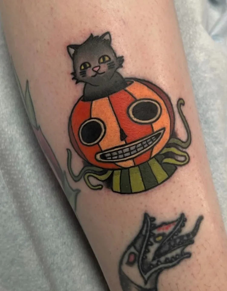 pumpkin robot and a cat halloween tattoo