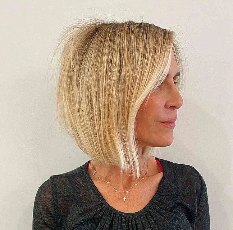 rejuvenating medium length angled bob for ladies at age 50