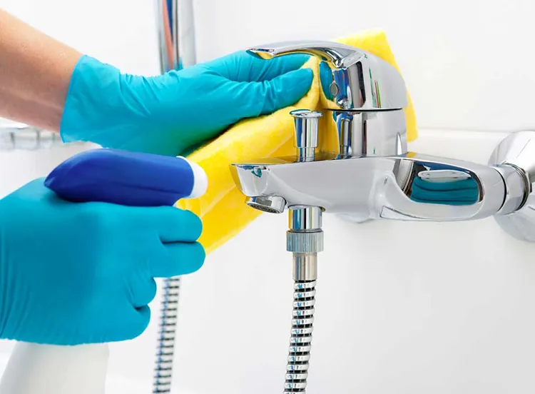 remove limescale from taps using commercial limestone cleaner