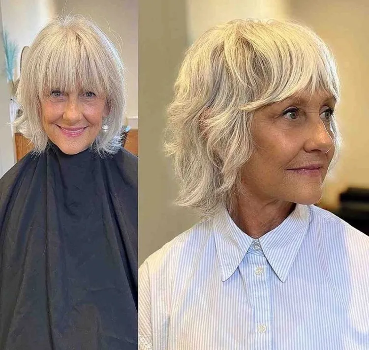 Corte de pelo Shaggy Bob con flequillo de cortina para mujeres mayores de 60 años con cabello blanco.