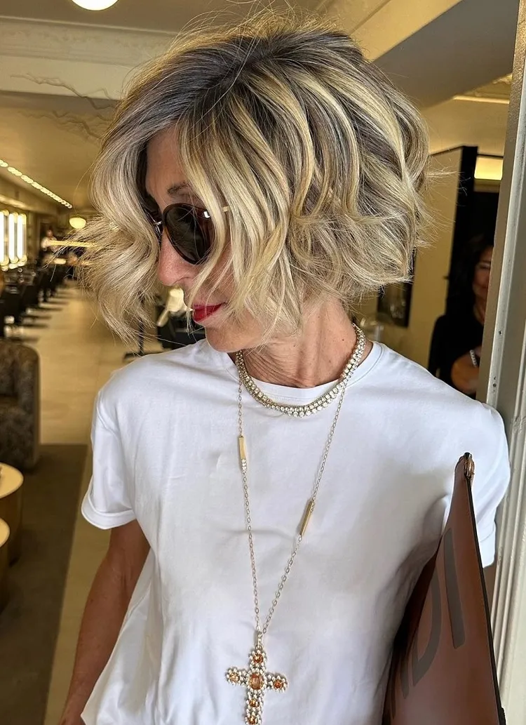 short bob with highlights and side swept bangs for women over 60