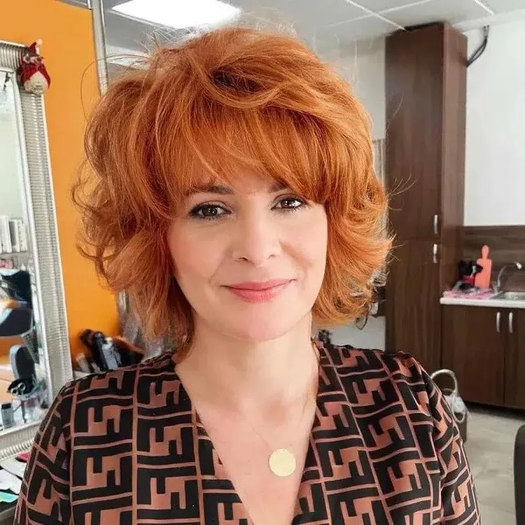 short hairstyle with bangs for a 50 year old woman
