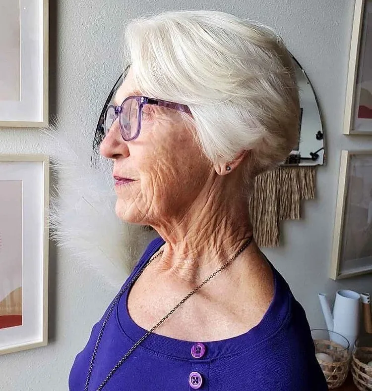 short white layered bob for 70 year old woman with large glasses