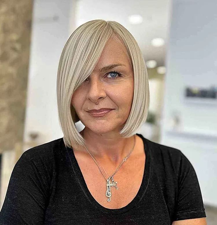 side parted blonde bob for 50 year old woman with straight hair