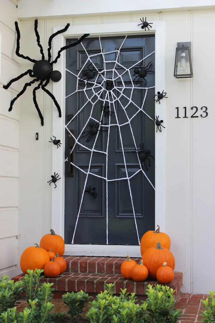 simple halloween front door decoration ideas with spider web