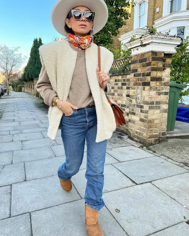 styling short classic sheepskin ugg boots for work straight blue jeans fuzzy vest colorful scarf wide brim hat