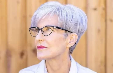 stylish youthful short hairstyles for women over 70 with glasses