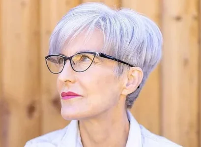 stylish youthful short hairstyles for women over 70 with glasses