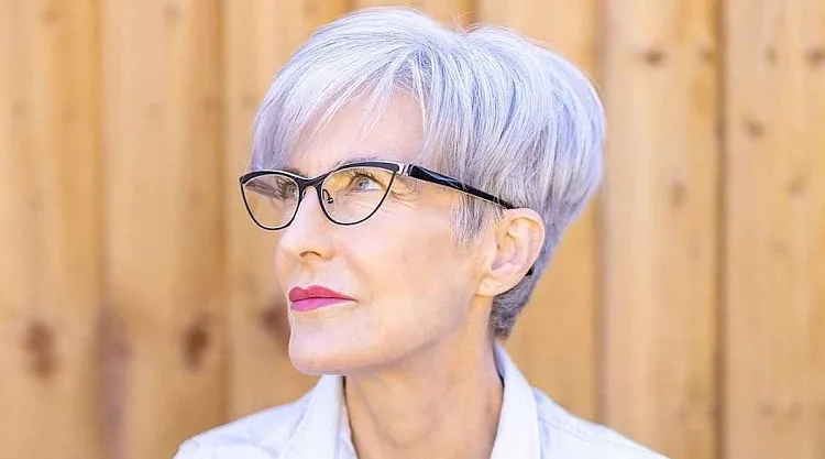 stylish youthful short hairstyles for women over 70 with glasses