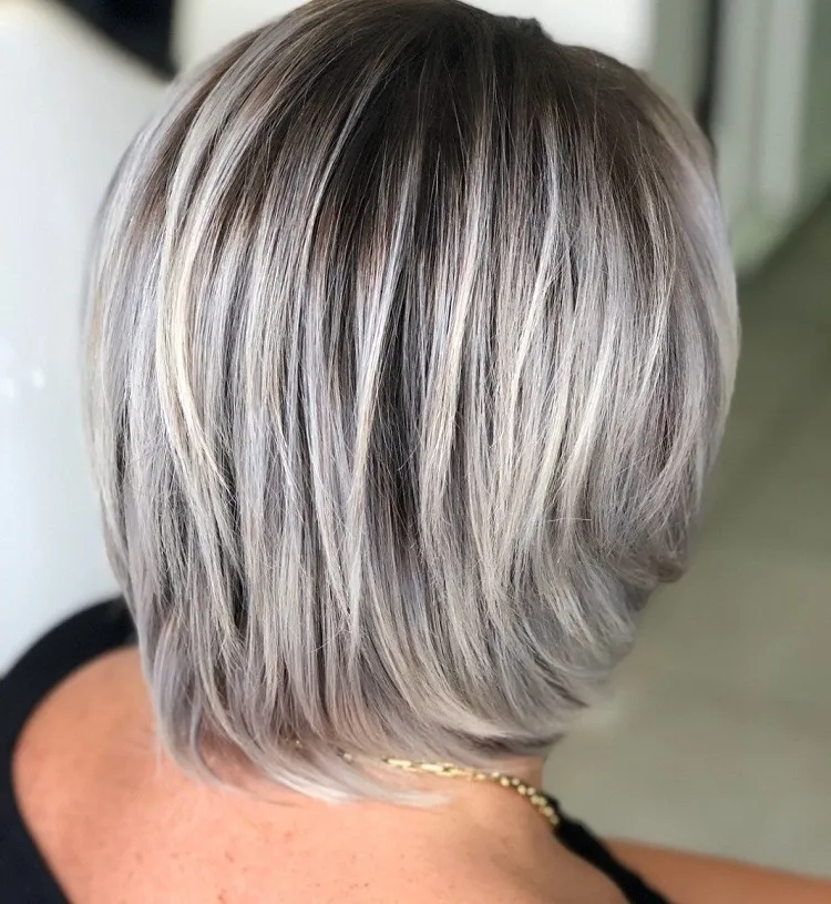 subtle lavender undertones in grey hair over 50