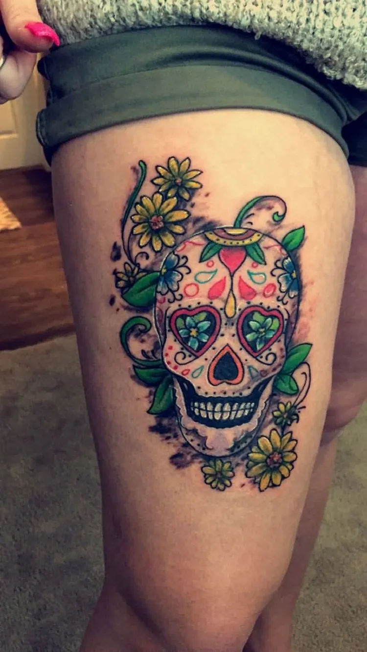 sugar skull tattoo on thigh for women