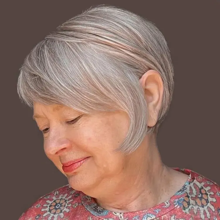 trendy short hairstyle for 65 year old woman with anti ageing effect