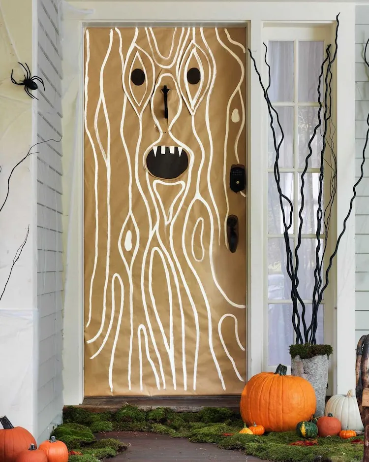 turn the front door into a spooky tree trunk