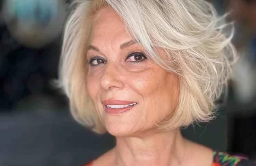 voluminous bob side swept bangs trendy short hairstyle women over 60